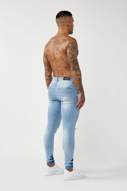 PREMIUM SPRAY-ON FIT JEANS - LIGHT BLUE RIPPED KNEE – Legend London