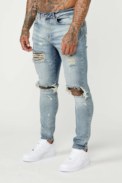 SKINNY FIT JEANS - MID BLUE RIPPED & REPAIRED – Legend London