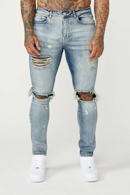 SKINNY FIT JEANS - MID BLUE RIPPED & REPAIRED – Legend London